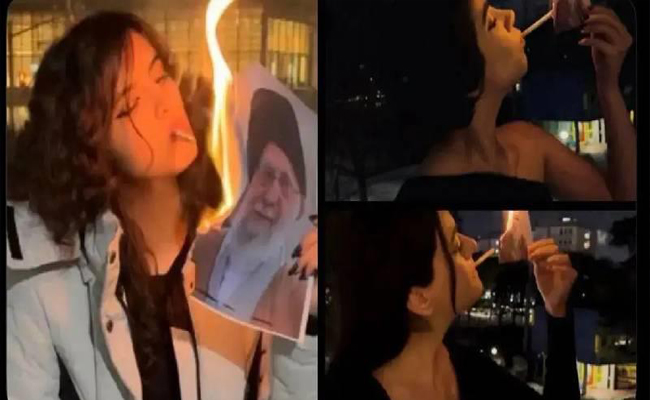പുകയുന്ന പ്രതിഷേധം: ഇറാന്‍ പ്രക്ഷോഭത്തിനിടെ ഖൊമേനിയുടെ ചിത്രം ഉപയോഗിച്ച് സിഗററ്റ് പുകച്ച് സ്ത്രീകള്‍
